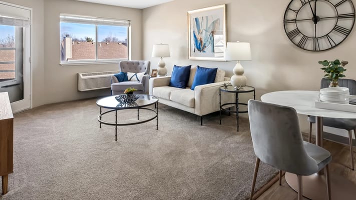 Bright and inviting interior living space with a sofa and dining area