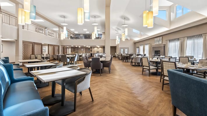 Spacious dining room with tables set for meals