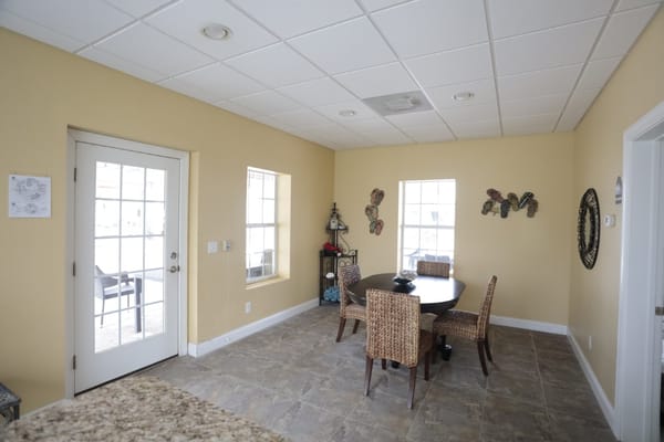 Bright common area with table and chairs