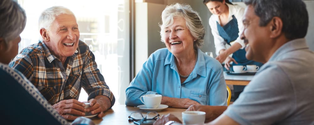 Residents enjoying a conversation at a communal table