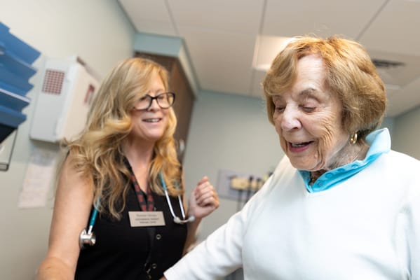 A caregiver assisting a resident in a facility