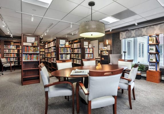 Bright library area with bookshelves and seating