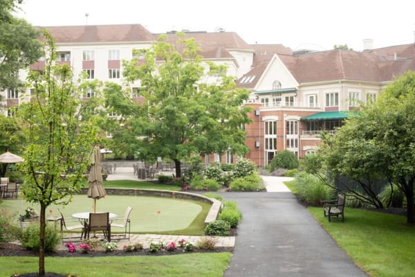 Outdoor space with gardens and seating at Fox Hill Village