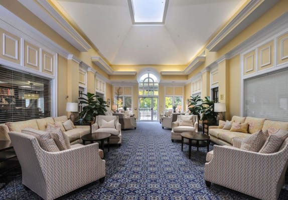 Common area lounge with seating and natural light