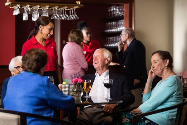 Residents enjoying a meal in a dining area