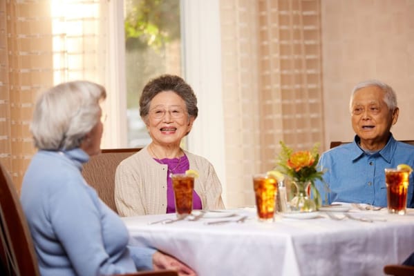 Residents enjoying a meal in the dining room