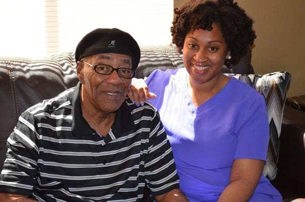 Caregiver with a resident in an inviting interior space