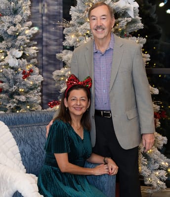 Residents posing for a festive photo in a decorated area