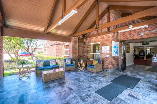 Entrance area with seating and garden views