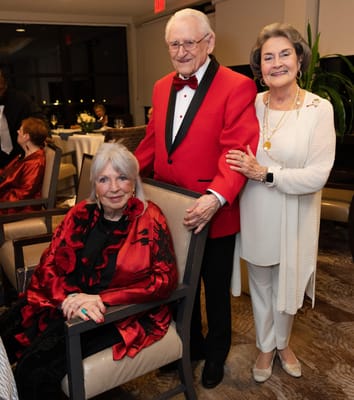 Residents dressed for a celebration in a common area.