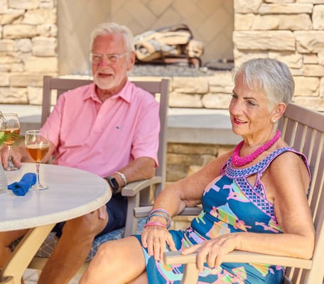 Couple enjoying drinks outdoors at a social gathering