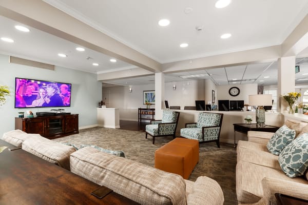 Bright common area with seating and a television