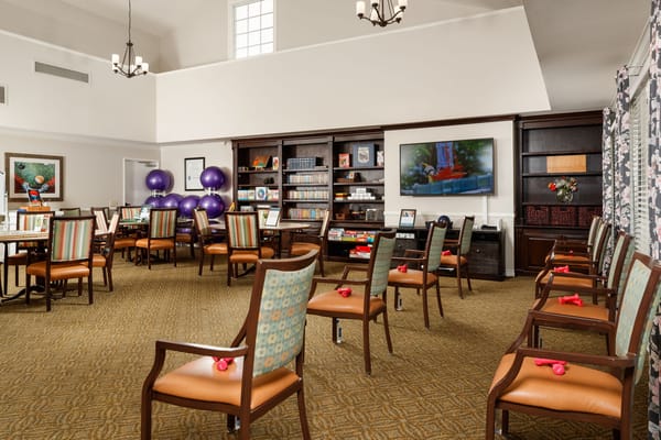 Bright activity room with chairs and games