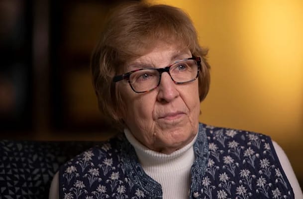 A thoughtful resident in a cozy interior setting