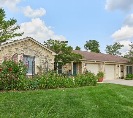 Exterior view of Marquette Senior Living with gardens