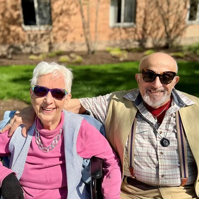 Two residents enjoying the outdoors in sunny weather