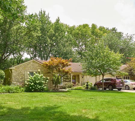 Exterior view of Marquette Senior Living building surrounded by greenery