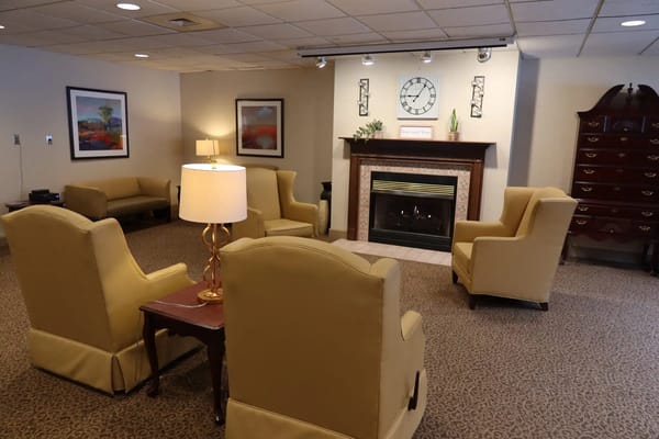 Cozy lounge area with seating and a fireplace