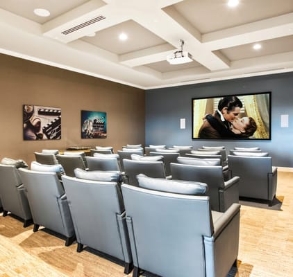 Interior view of a cozy movie theater room with seats
