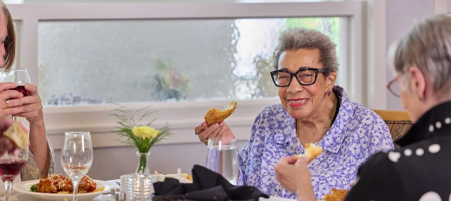 Residents enjoying a meal in the dining area