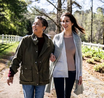 Two women enjoying a walk in a serene outdoor setting