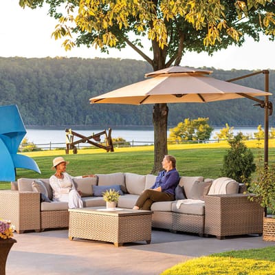 Residents relaxing on a patio with views of the river