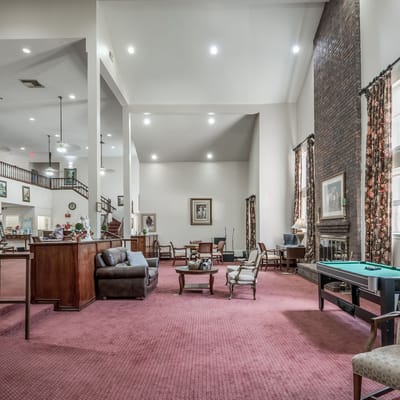 Common area with seating and decorations in a senior living facility