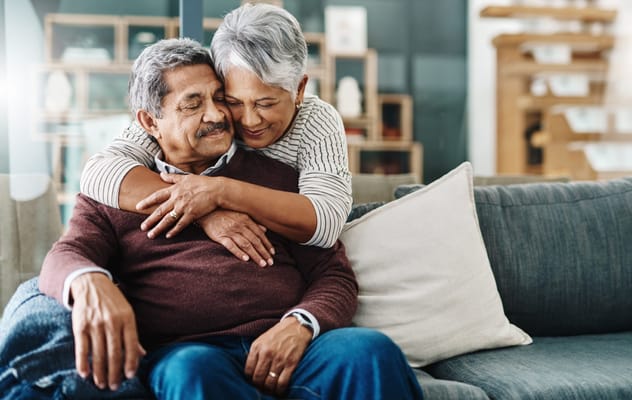 Couple embracing on a comfortable sofa