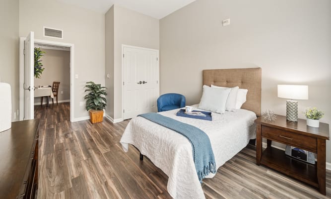 Comfortable private resident room with a bed and decor