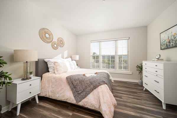 Bright, well-decorated private bedroom in a facility