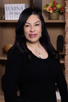 Staff member posing in the interior of the facility