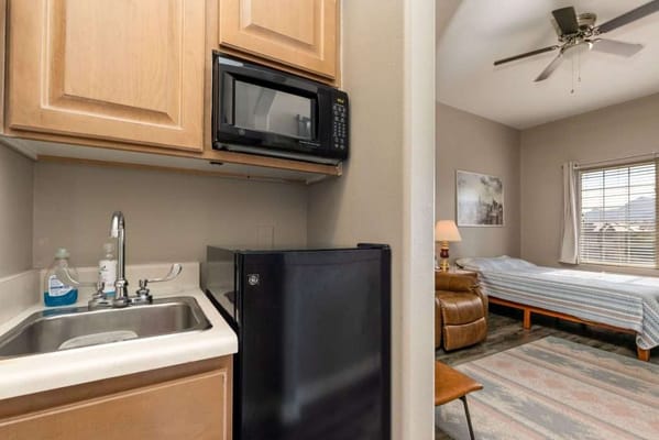 Interior view of a resident's room with kitchenette