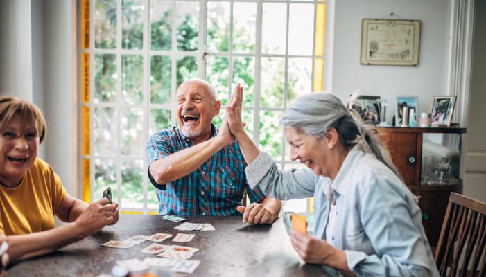 Residents enjoying a game together in a common area