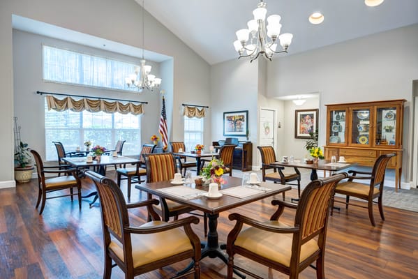 Bright dining room with tables and chairs