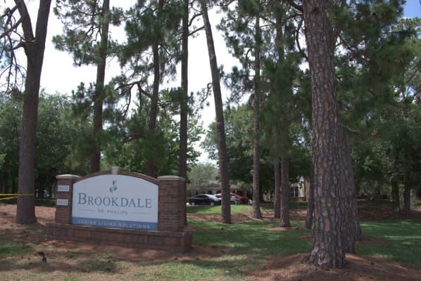 Sign of Brookdale Dr. Phillips surrounded by trees