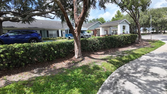 Outdoor view of Brookdale Conway's front entrance and landscaping.