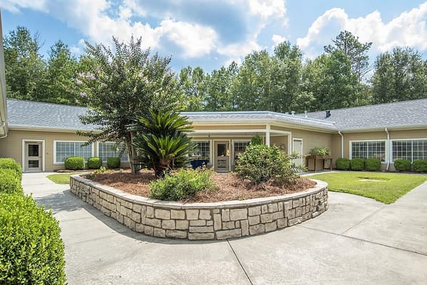Well-maintained outdoor garden area with landscaping