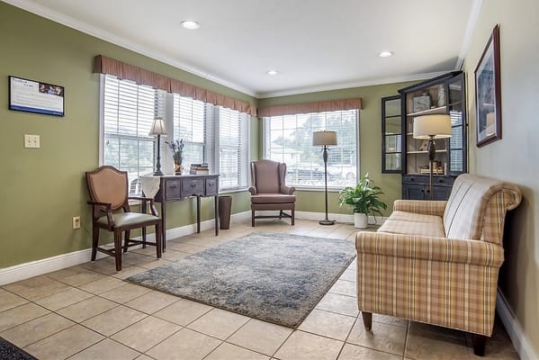 Bright common area with seating and plants