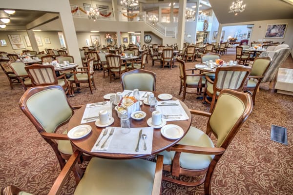 Set dining table in the dining area of The Hampshire senior living community.