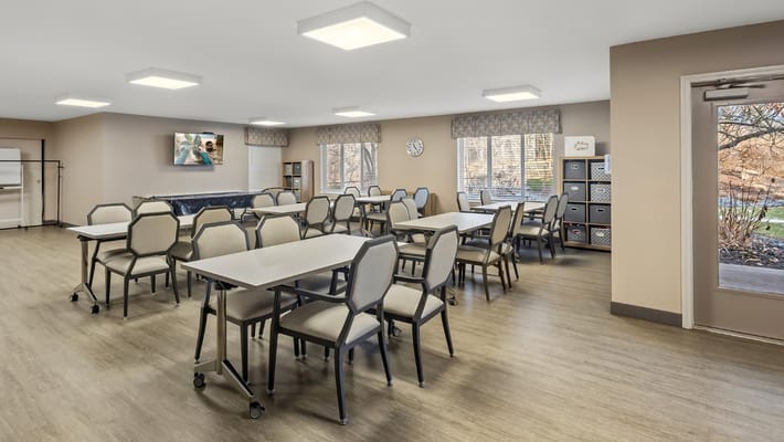 Bright common area with tables and chairs