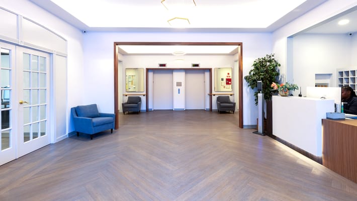 Bright lobby area with seating and elevators