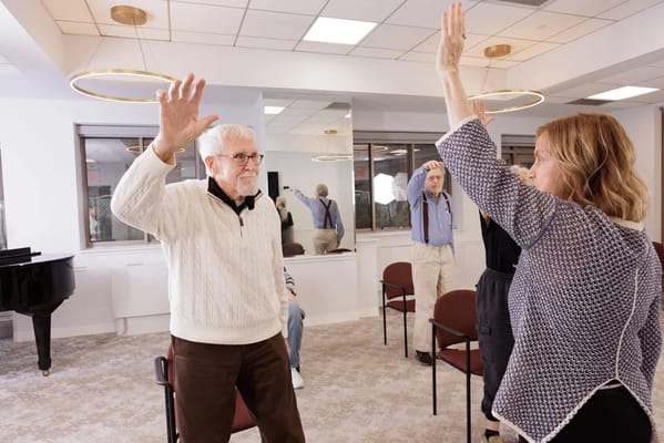Residents participating in a group activity in a common area