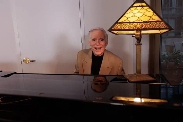 Resident playing piano in a bright interior