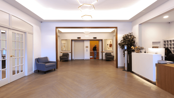 Interior lobby with seating area and reception desk