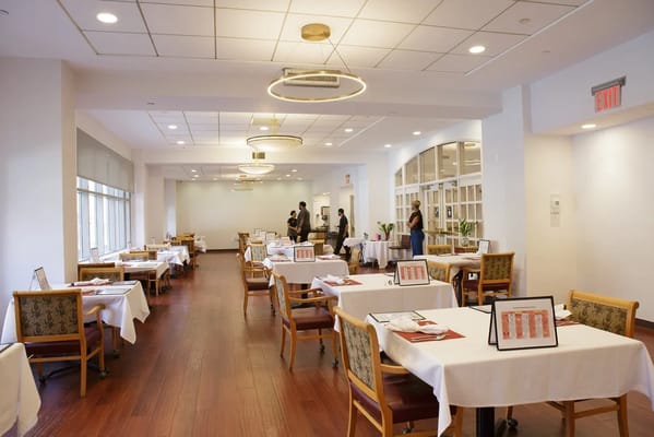 Bright dining area with tables set for meals