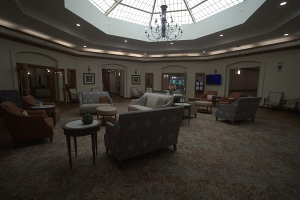 Common area with seating and chandelier