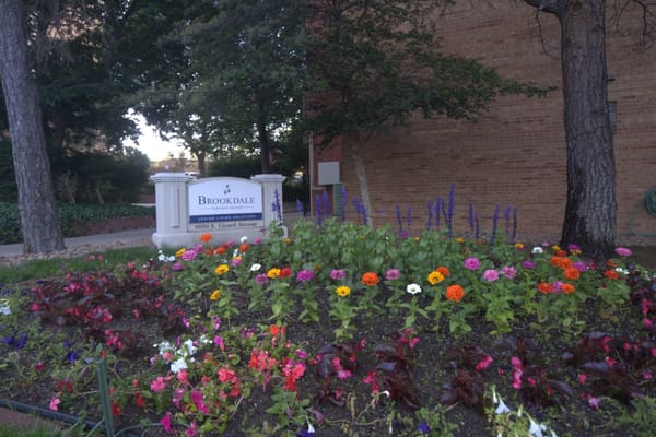 Colorful flower bed in front of Brookdale Tamarac Square