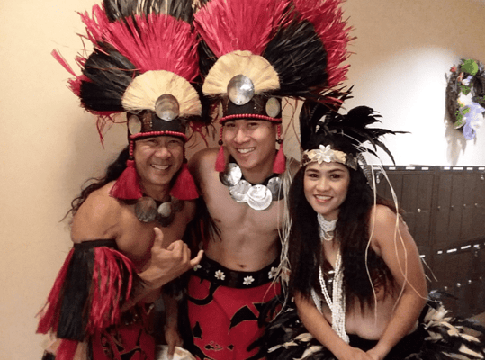 Cultural performance by individuals in traditional attire