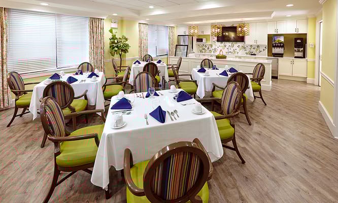 Dining room set with tables and chairs for residents