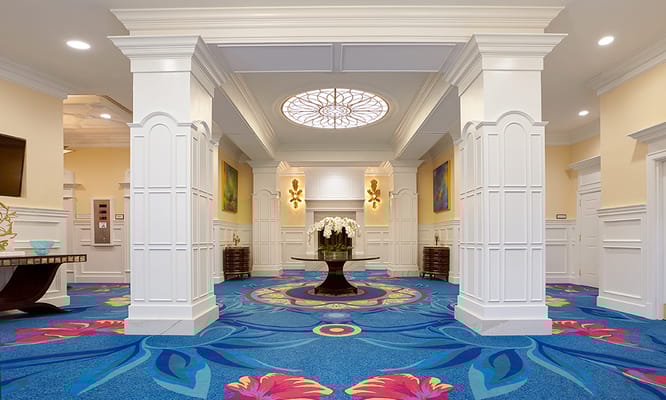 Brightly colored lobby area with vibrant carpet and decor
